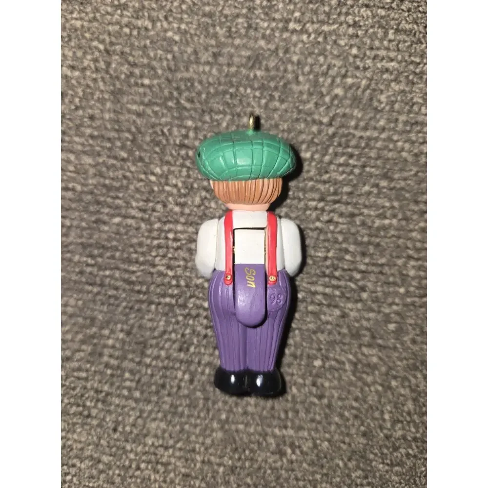 1998 Hallmark Miniature Christmas Ornament Boy Green Hat Purple Pants 2.5